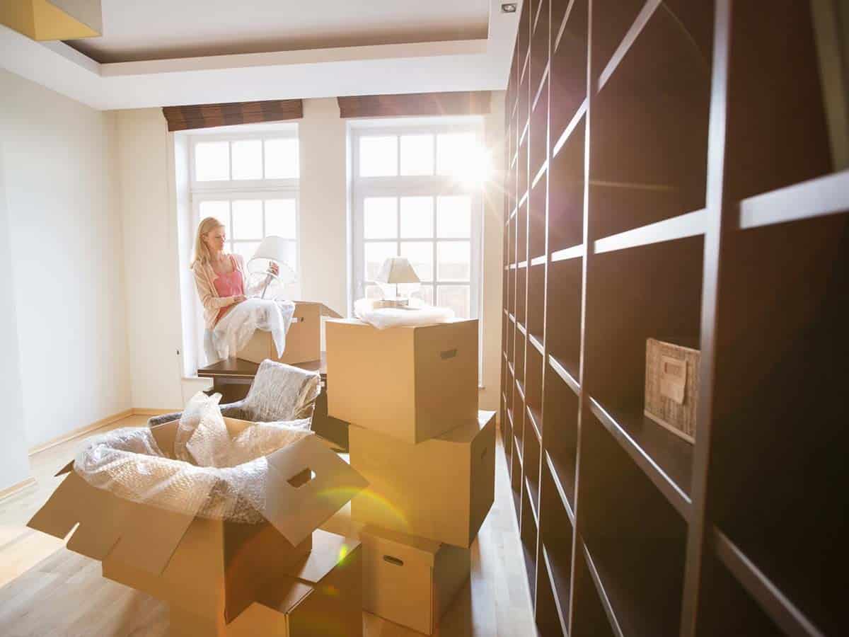 A woman packing up boxes for a move