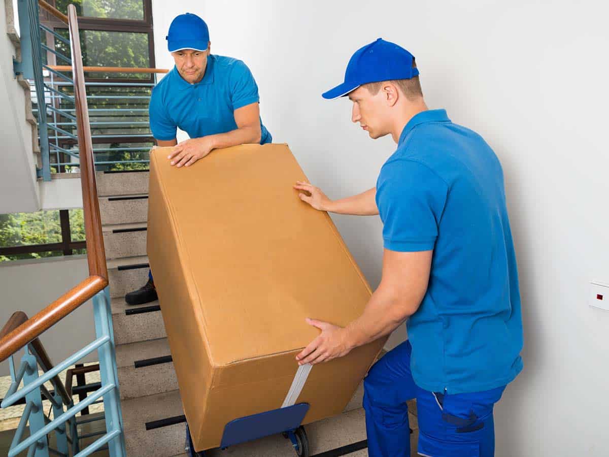 1200x900GMB-4 Two professional movers moving boxes