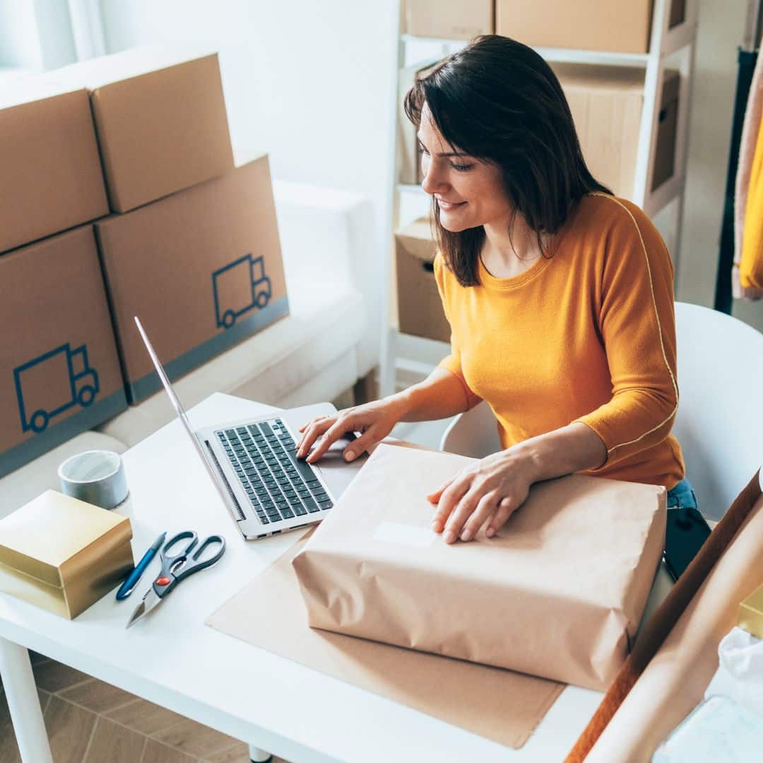 small business owner packing up boxes