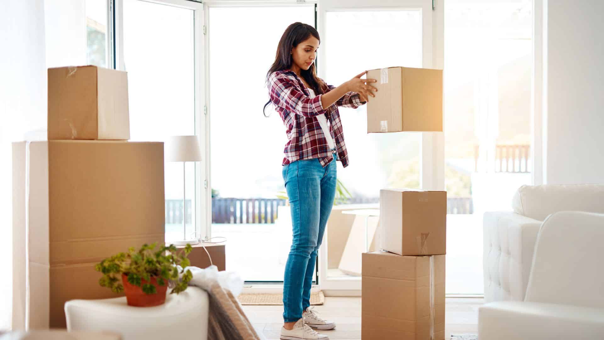 woman stacking boxes