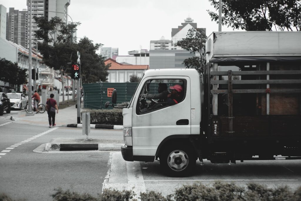 A large commercial moving truck parked in an urban setting.