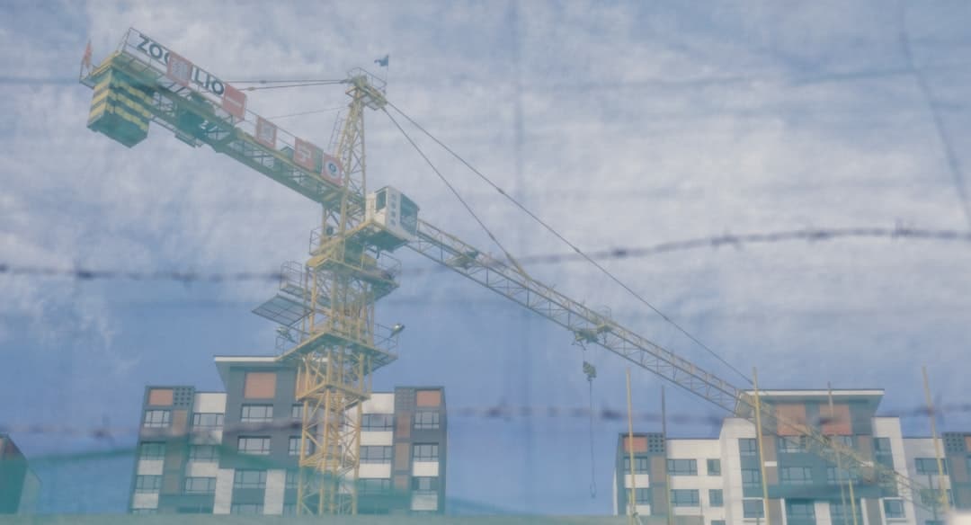 An aerial view of a city showing complex urban infrastructure and traffic flow.