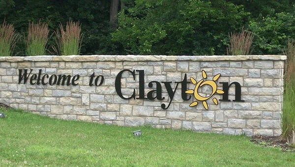 Abe Lincoln Movers logo on a stone wall welcoming visitors to Clay County.