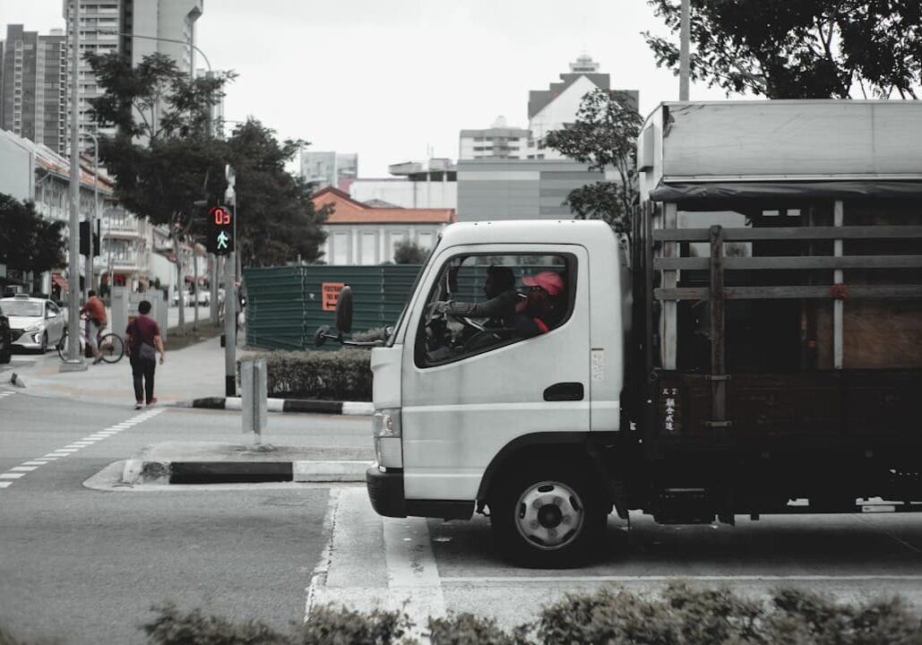 A large commercial moving truck parked in an urban setting.